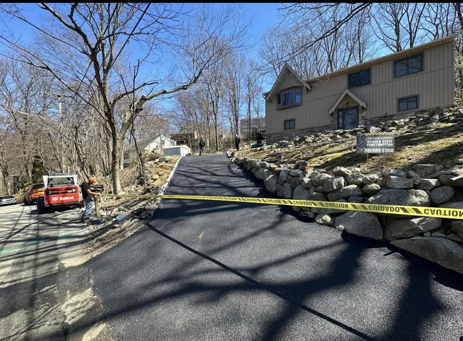 Asphalt driveway on a wooded New Jersey hillside